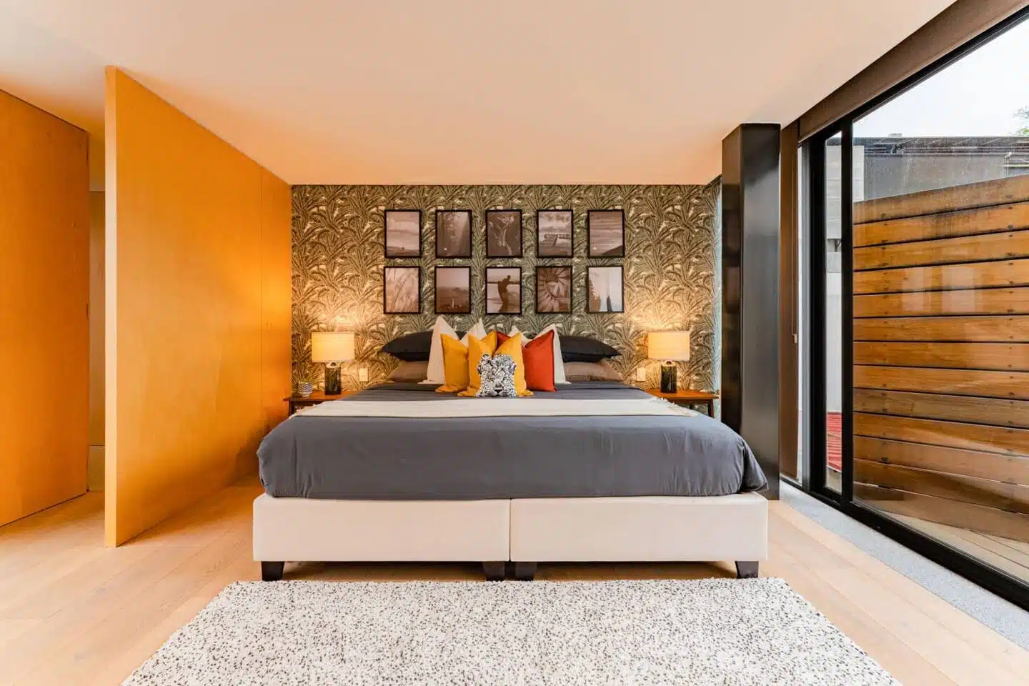 Premium master bedroom interior featuring a large bed and panoramic glass door views at Polanco Penthouse Mexico City.