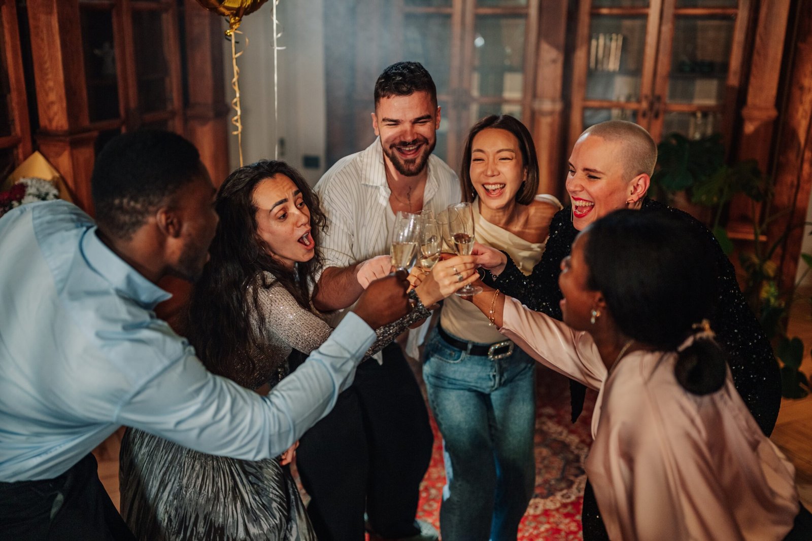 Friends celebrating a post-wedding party in Mexico City with food, drinks, and live music