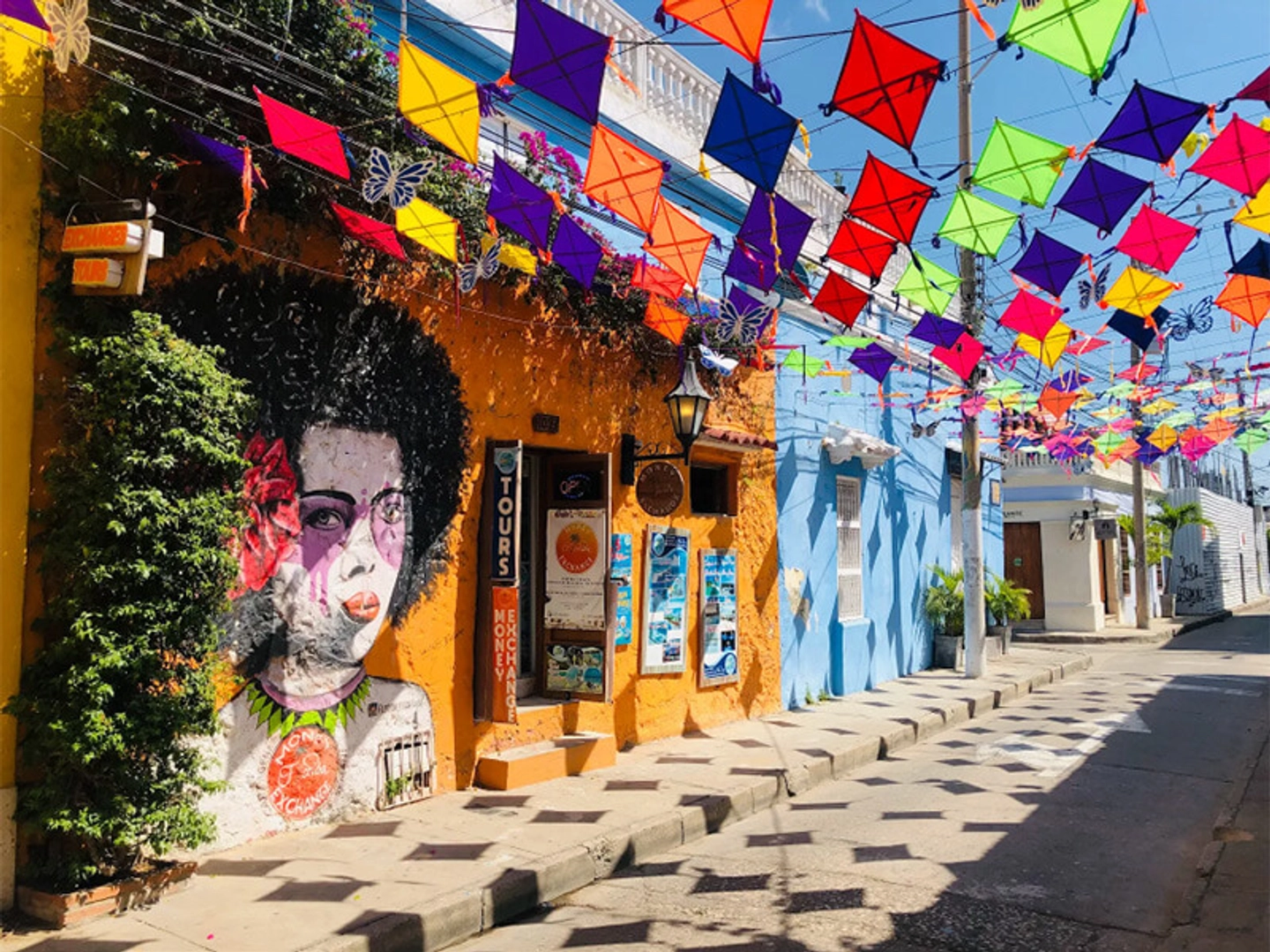 Flags above colonial street in Getsemaní neighborhood, Cartagena, Colombia